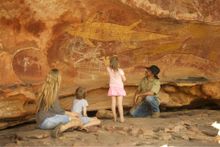 Kuku Yalanji guides tell the story of the ancient Quinkan rock art on Jarramali Rock Art Tours.