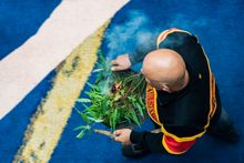 Wurundjeri Elder Uncle Bill Nicholson performs a ceremonial cleansing at Pentridge