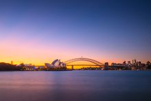 Sun setting over the Sydney Opera House and the Sydney Harbour Bridge, Sydney