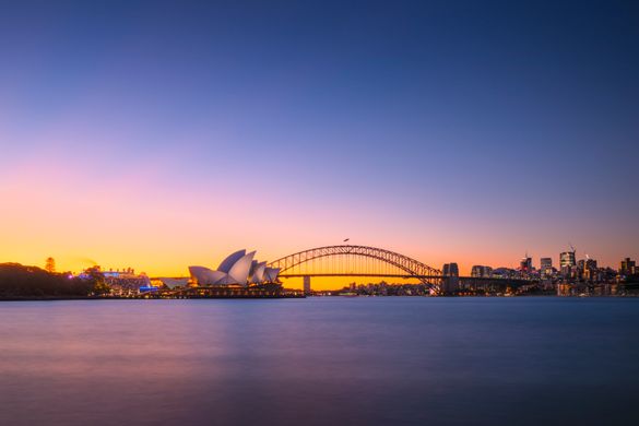 Sun setting over the Sydney Opera House and the Sydney Harbour Bridge, Sydney