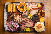 A platter of assorted barbecue meats and sides from The Beefy Boys' BBQ nights