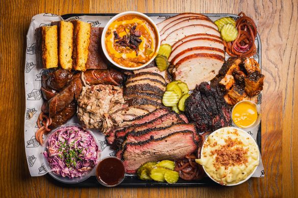 A platter of assorted barbecue meats and sides from The Beefy Boys' BBQ nights