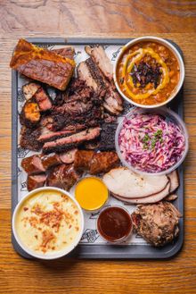 Assorted Beefy Boys barbecue meats and sides on a tray.