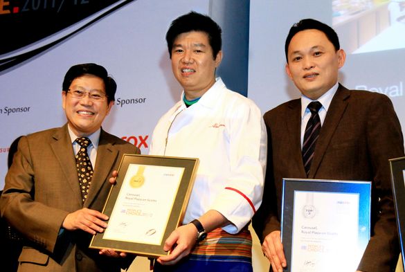 Abraham Tan, Culinary Executive Chef, and Alvin Chan, Restaurant and Bar Operations Manager, RP with GOH Mr Yeo Guat Kwang, Pres