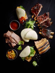 Smokey meats platter, Wagyu brisket, lamb ribs, pork belly, cucumber and sweet buns