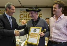  (L to R) Markel Olano Arrese, general deputy of Gipuzkoa, presenting the World Cheese Awards Champion of Champions trophy to Ingulf Galaaen, Norwegian cheesemaker from Røros, who accepted the award on Tingvollost’s behalf, with John Farrand, managing dir