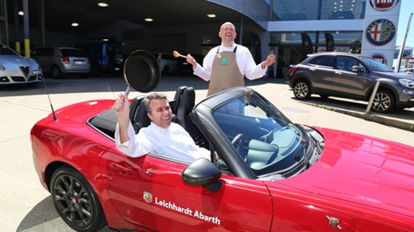 Chef Oliver Heath (standing), Cooking Stage MC Enzo Guarino in the new 124 Fiat Sprint Chef Oliver Heath (standing), Cooking Stage MC Enzo Guarino in the new 124 Fiat Sprint