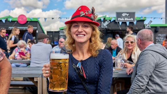 A lady enjoying a stein of beer at Folkestone Harbour's Wunder Harbour